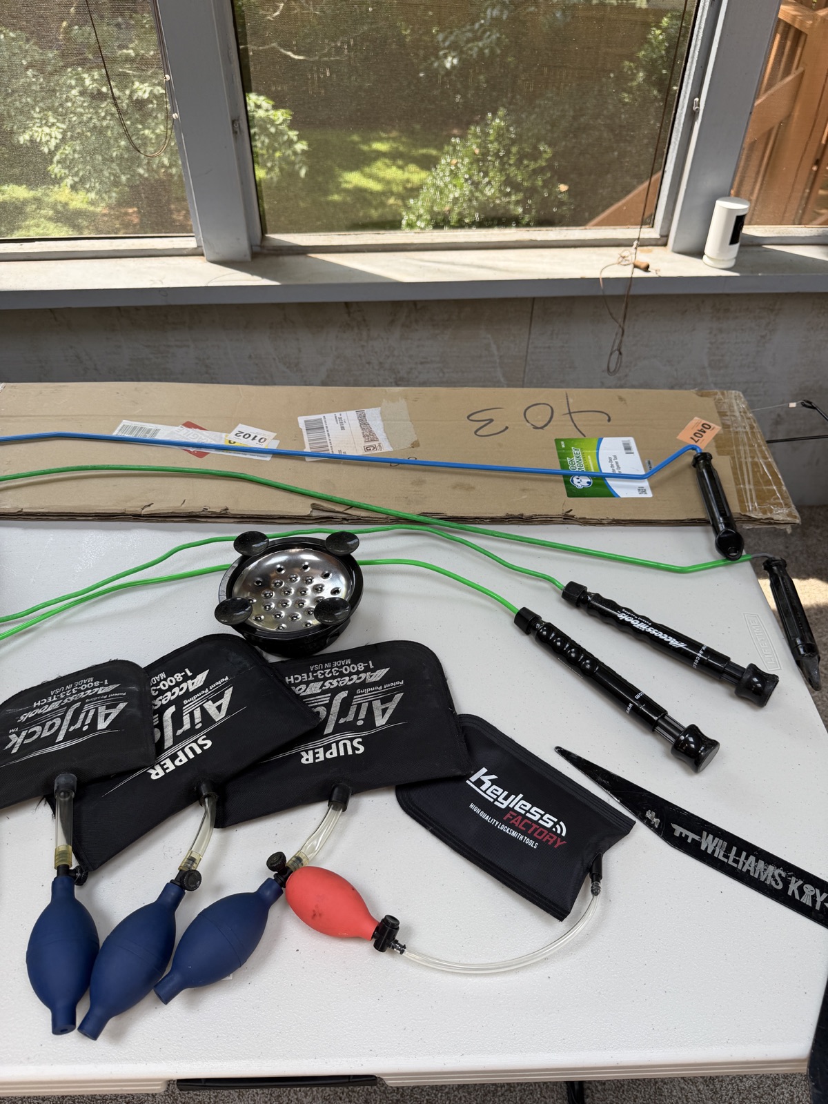 Air wedges and long-reach tools for vehicle lockout service